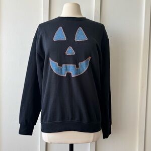 Upcycled Black Crewneck‎ with Denim Jack-O’-Lantern Face